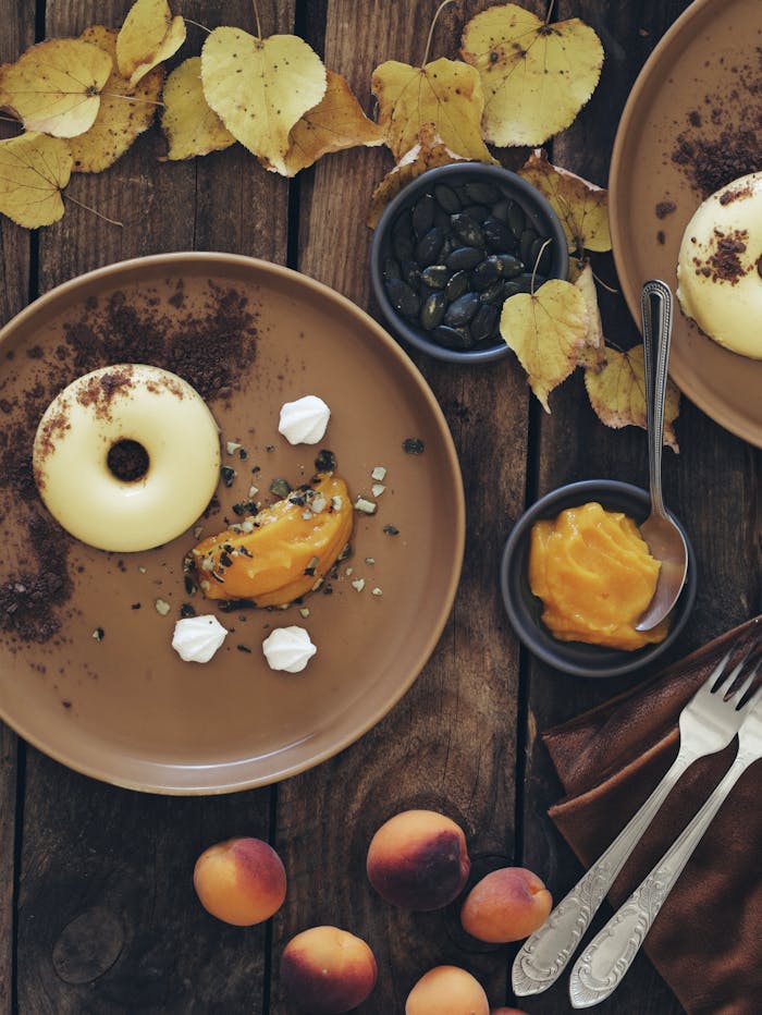 autumn-dessert-scene-with-pumpkin-dish-and-leaves-33854076